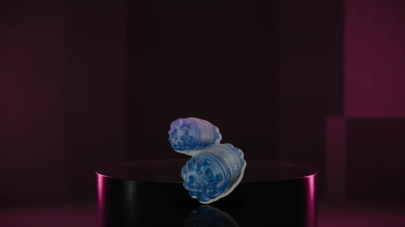 Quickshot Turbo on a glossy black pedestal with magenta rim light